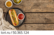 top view hot dog with pickles plate. Стоковое фото, агентство Ingram Publishing / Фотобанк Лори