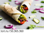 arabic kebab sandwich wrapped thin pita. Стоковое фото, агентство Ingram Publishing / Фотобанк Лори