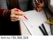 high angle girl with down syndrome woman drawing. Стоковое фото, агентство Ingram Publishing / Фотобанк Лори