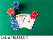 high angle view royal flush playing cards with casino chips poker table. Стоковое фото, агентство Ingram Publishing / Фотобанк Лори