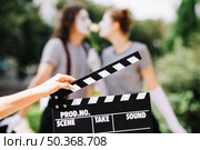 close up hand holding clapperboard. Стоковое фото, агентство Ingram Publishing / Фотобанк Лори
