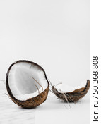coconut shell white background. Стоковое фото, агентство Ingram Publishing / Фотобанк Лори