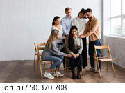 woman being consoled by people group therapy session. Стоковое фото, агентство Ingram Publishing / Фотобанк Лори