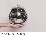 front view hand held disco ball. Стоковое фото, агентство Ingram Publishing / Фотобанк Лори