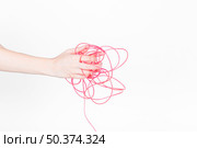 human hand with tangled red wire. Стоковое фото, агентство Ingram Publishing / Фотобанк Лори