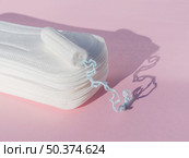pile daily pads with shadow tampon high view. Стоковое фото, агентство Ingram Publishing / Фотобанк Лори