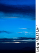 starry night with clouds blue shades. Стоковое фото, агентство Ingram Publishing / Фотобанк Лори