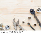 OLYMPUS DIGITAL CAMERA. various wrenches near nozzles table. Стоковое фото, агентство Ingram Publishing / Фотобанк Лори