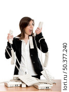Busy woman working and answering a lot of calls at the same time. Стоковое фото, агентство Ingram Publishing / Фотобанк Лори