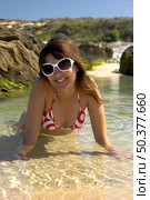 Beautiful happy woman taking a b ath on the water. Стоковое фото, агентство Ingram Publishing / Фотобанк Лори