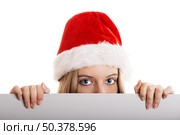 Female santa holding a christmas white card - isolated over a white background. Стоковое фото, агентство Ingram Publishing / Фотобанк Лори