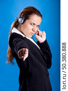 Portrait of a beautiful and young businesswoman with headsets. Стоковое фото, агентство Ingram Publishing / Фотобанк Лори