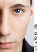 Fashion portrait of a young man with blue eyes - OBS: model use lens contact. Стоковое фото, агентство Ingram Publishing / Фотобанк Лори