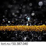 glimmering golden glitter. Стоковое фото, агентство Ingram Publishing / Фотобанк Лори