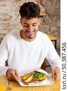 medium shot man with delicious food. Стоковое фото, агентство Ingram Publishing / Фотобанк Лори
