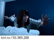 Conceptual image of a beautiful young woman fluctuate while dreaming. Стоковое фото, агентство Ingram Publishing / Фотобанк Лори