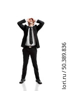 Young businessman worried with a bad business, isolated over a white background . Стоковое фото, агентство Ingram Publishing / Фотобанк Лори