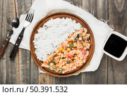 chinese fried steamed rice wooden plate with soya sauce table. Стоковое фото, агентство Ingram Publishing / Фотобанк Лори
