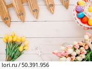 easter prop tulips easter eggs tulips fence wooden desk. Стоковое фото, агентство Ingram Publishing / Фотобанк Лори
