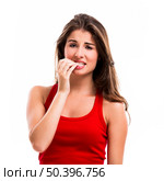 Beautiful young woman biting her nails, isolated over a white background. Стоковое фото, агентство Ingram Publishing / Фотобанк Лори