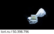 magician performing trick with playing cards against black background. Стоковое фото, агентство Ingram Publishing / Фотобанк Лори