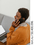 african american man remote working from his home. Стоковое фото, агентство Ingram Publishing / Фотобанк Лори