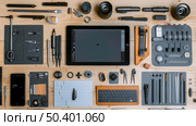 Various tools are neatly arranged on a table, including hammers, screwdrivers, wrenches, pliers, and measuring tape. Стоковое AI-изображение, AI-художник Данила Большаков / Фотобанк Лори