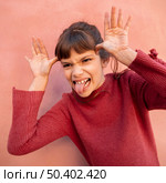 portrait cute girl making fun face 2. Стоковое фото, агентство Ingram Publishing / Фотобанк Лори