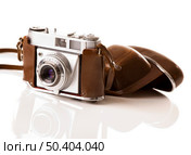 Old fashioned photography camera isolated over a white background. Стоковое фото, агентство Ingram Publishing / Фотобанк Лори