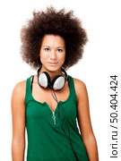 Beautiful woman with headphones on the neck, isolated on white . Стоковое фото, агентство Ingram Publishing / Фотобанк Лори