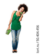 Afro-American young woman answering a call, isolated on white background. Стоковое фото, агентство Ingram Publishing / Фотобанк Лори