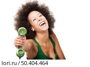 Afro-American young woman answering a call, isolated on white background. Стоковое фото, агентство Ingram Publishing / Фотобанк Лори