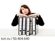 Exhausted woman in the office full of folders and work to do, isolated on white background. Стоковое фото, агентство Ingram Publishing / Фотобанк Лори