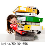 Business woman in the office embracing a pile of folders, isolated on white background. Стоковое фото, агентство Ingram Publishing / Фотобанк Лори