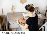high angle female tailor working studio 2. Стоковое фото, агентство Ingram Publishing / Фотобанк Лори