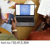 high angle couple making plans renovate house using color palette laptop. Стоковое фото, агентство Ingram Publishing / Фотобанк Лори