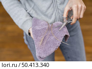 high angle hairdresser holding cloth scissors with tuft hair. Стоковое фото, агентство Ingram Publishing / Фотобанк Лори