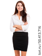 Beautiful hispanic business woman smiling with hands folded, over a white background. Стоковое фото, агентство Ingram Publishing / Фотобанк Лори
