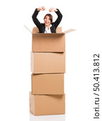 Happy business woman appear inside big card boxes, isolated over white background. Стоковое фото, агентство Ingram Publishing / Фотобанк Лори