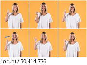 set happy woman showing deaf sign against yellow wall. Стоковое фото, агентство Ingram Publishing / Фотобанк Лори