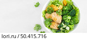 Chicken nuggets with broccoli, corn, cucumbers and salad lettuce. Top view. Banner. Стоковое фото, агентство Ingram Publishing / Фотобанк Лори