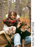 young woman spending time together with her dog forest 2. Стоковое фото, агентство Ingram Publishing / Фотобанк Лори
