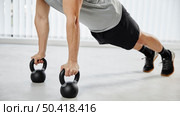 close up man exercising with dumbbells. Стоковое фото, агентство Ingram Publishing / Фотобанк Лори