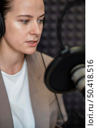 close up woman talking radio. Стоковое фото, агентство Ingram Publishing / Фотобанк Лори
