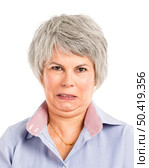 Portrait of a elderly woman with a angry expression. Стоковое фото, агентство Ingram Publishing / Фотобанк Лори