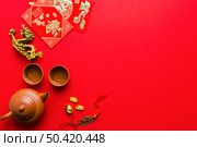 dragon statuette near tea ceremony supplies. Стоковое фото, агентство Ingram Publishing / Фотобанк Лори