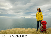 Female backpacker tourist in Icleand ready for adventure . Стоковое фото, агентство Ingram Publishing / Фотобанк Лори