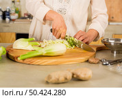 Preparing fermented preserved vegetables. Cabbage kimchi and sauerkraut sour cabbage. . Стоковое фото, агентство Ingram Publishing / Фотобанк Лори