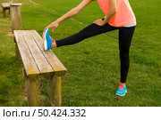 Beautiful woman stretching her muscles after finish the workout. Стоковое фото, агентство Ingram Publishing / Фотобанк Лори
