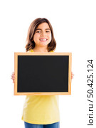 Young girl holding and showing something on a whiteboard. Стоковое фото, агентство Ingram Publishing / Фотобанк Лори